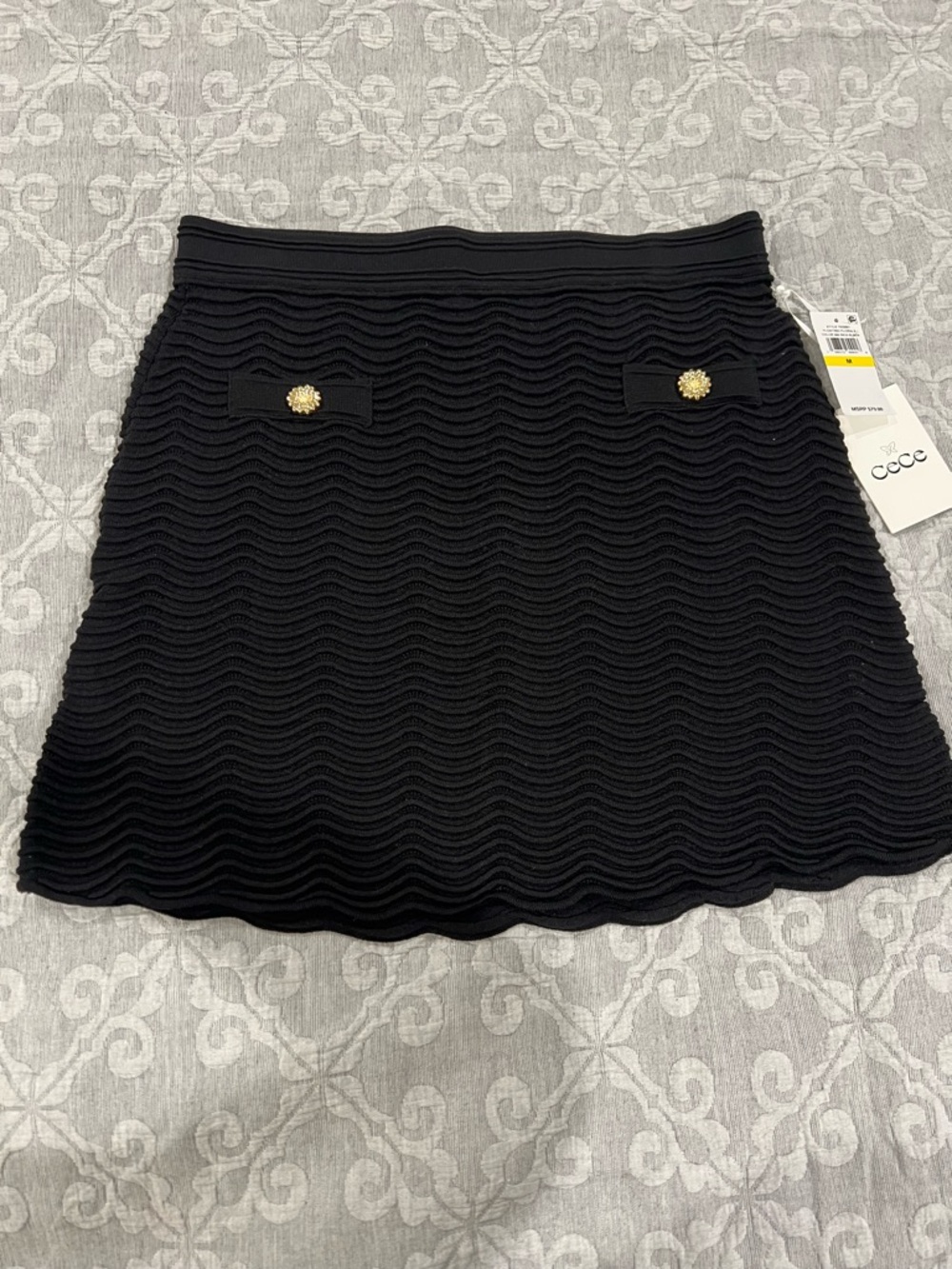 CeCe Black Wave-Textured Mini Skirt with Gold Button Accents